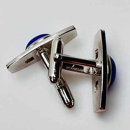 Silver-tone cufflinks with textured finish and vivid blue lucite cabochons, signed Anson