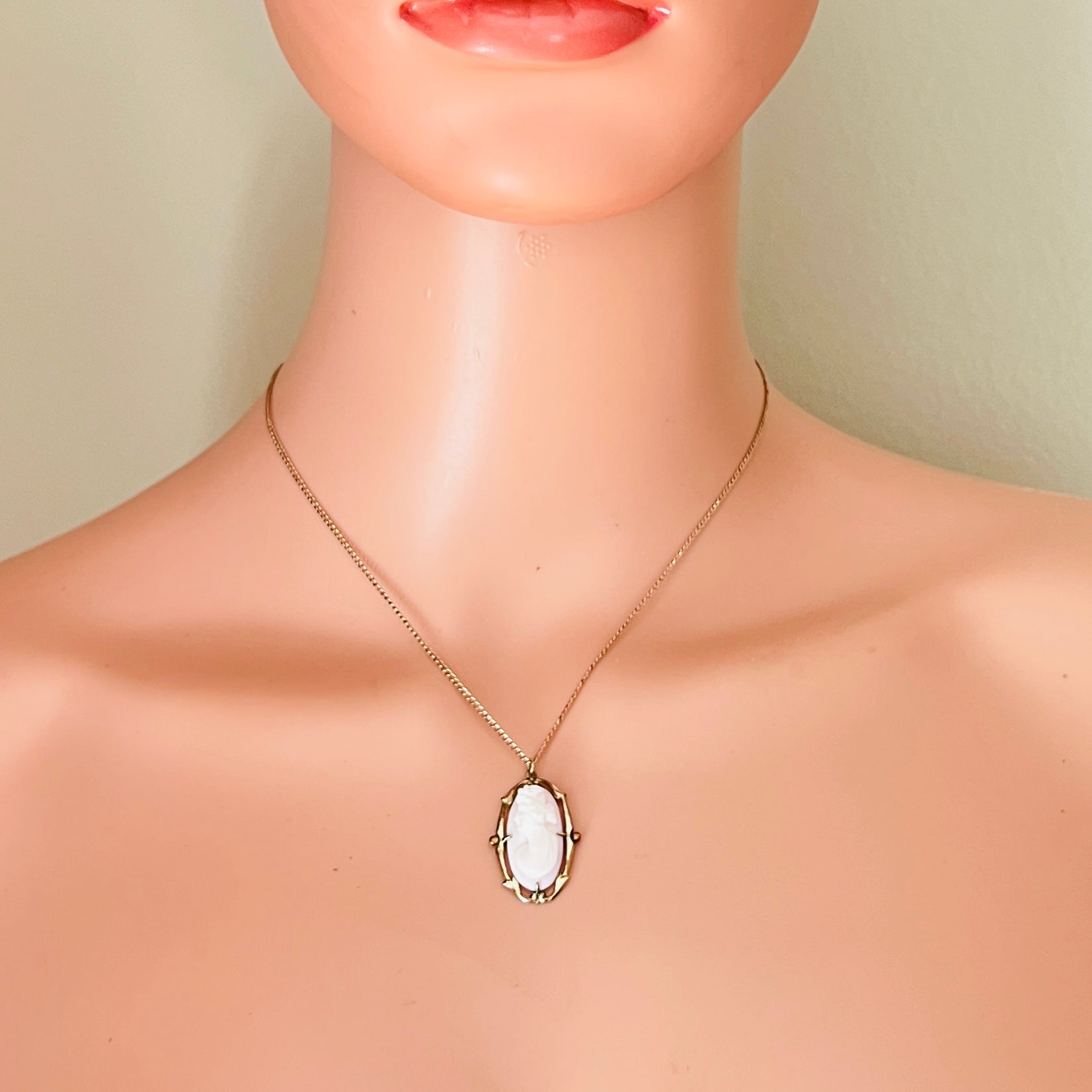 Antique cameo necklace worn on mannequin gold filled chain