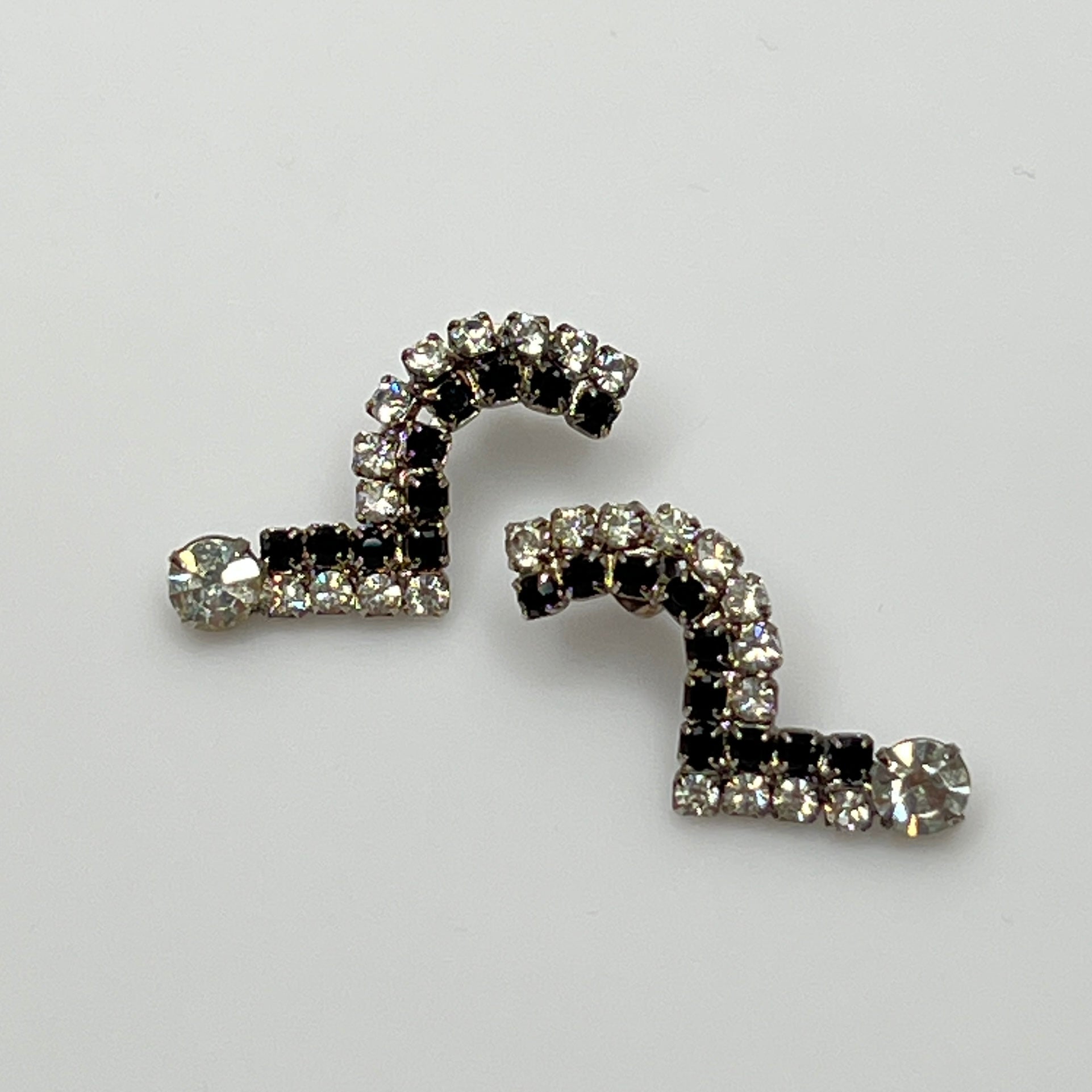 Art Deco-style vintage rhinestone earrings in black and clear zigzag shape