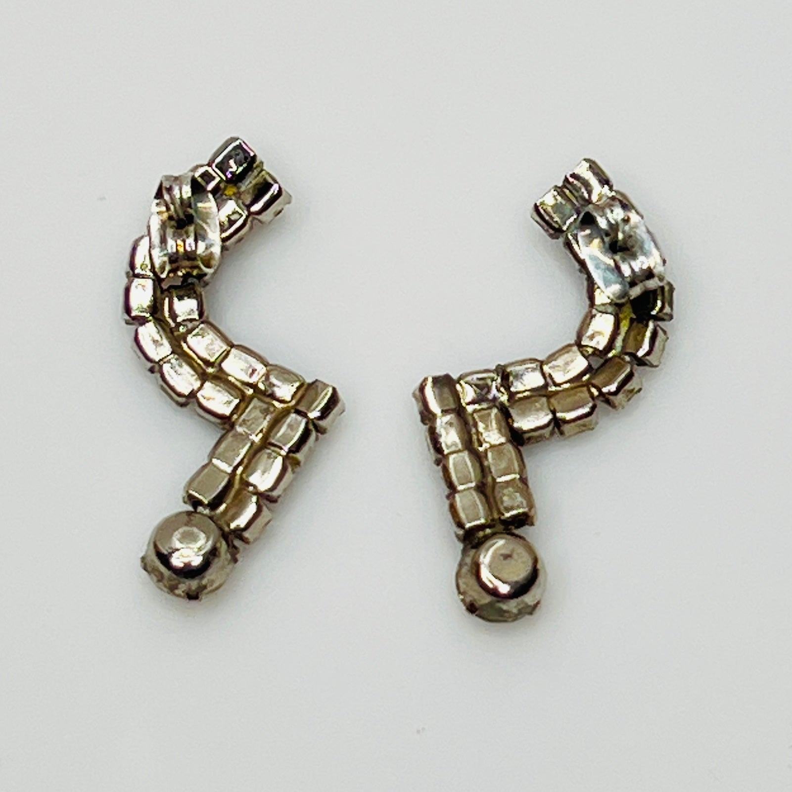 Pierced stud earrings with prong-set rhinestones and butterfly backs