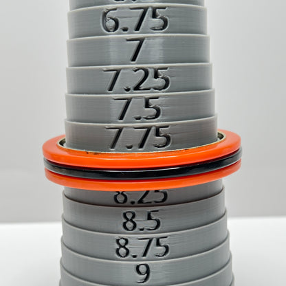 Orange Bakelite bangle bracelet with black stripe and gold-tone interior