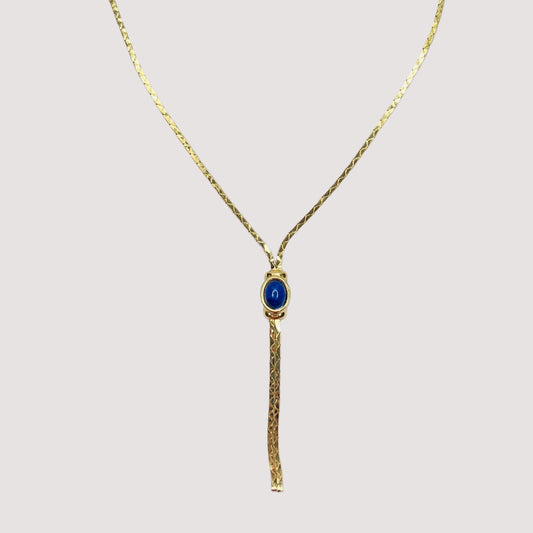 Full view of necklace with lariat drop and blue stone on white background