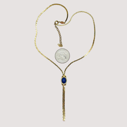 Full view of necklace with lariat drop and blue stone on white background