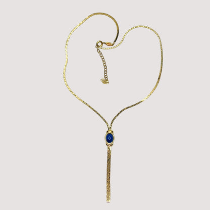 Full view of necklace with lariat drop and blue stone on white background