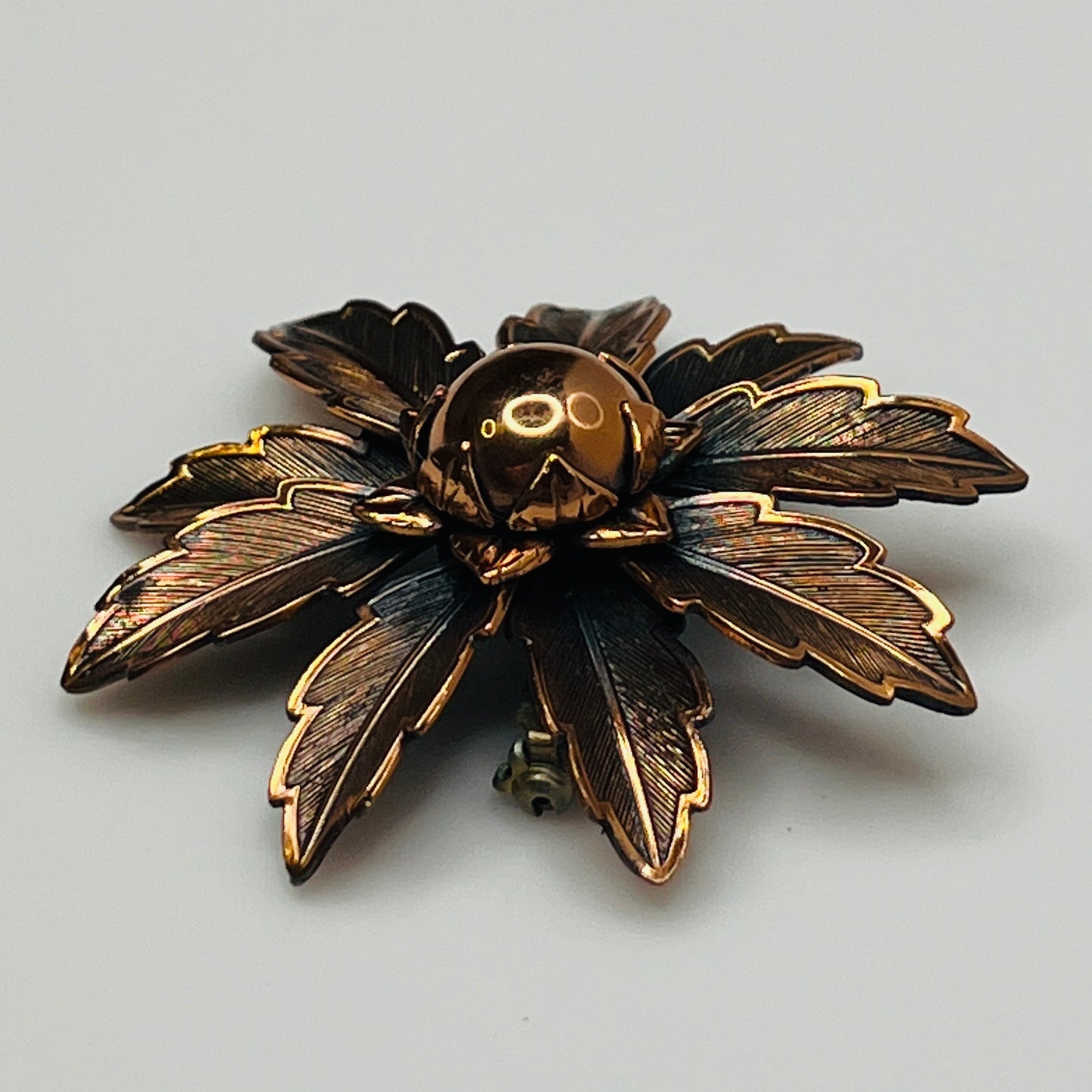 Vintage Copper Bell brooch with leaf motif and domed center flower