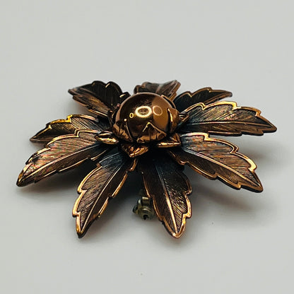 Vintage Copper Bell brooch with leaf motif and domed center flower