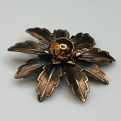 Vintage Copper Bell brooch with leaf motif and domed center flower