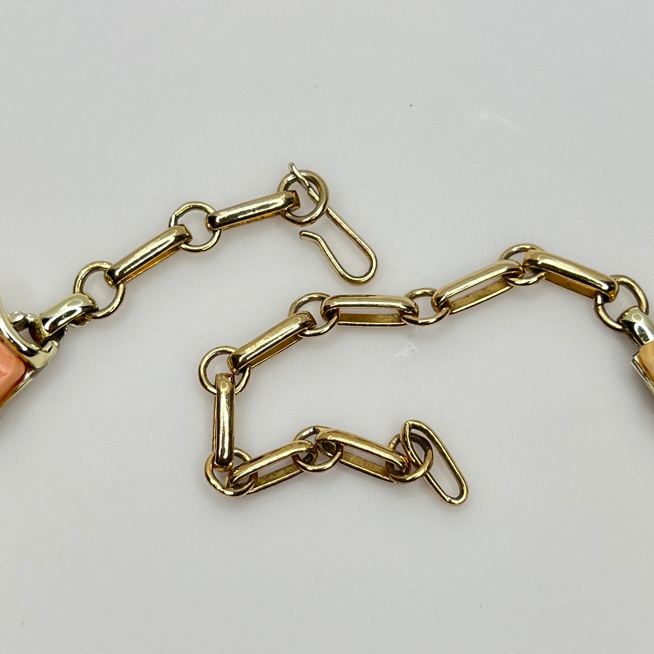 Close-up of signed Coro gold-tone hook clasp and extender chain