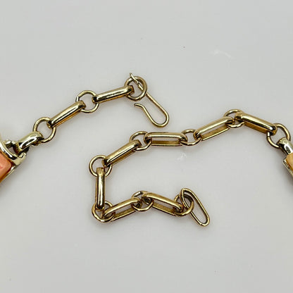 Close-up of signed Coro gold-tone hook clasp and extender chain