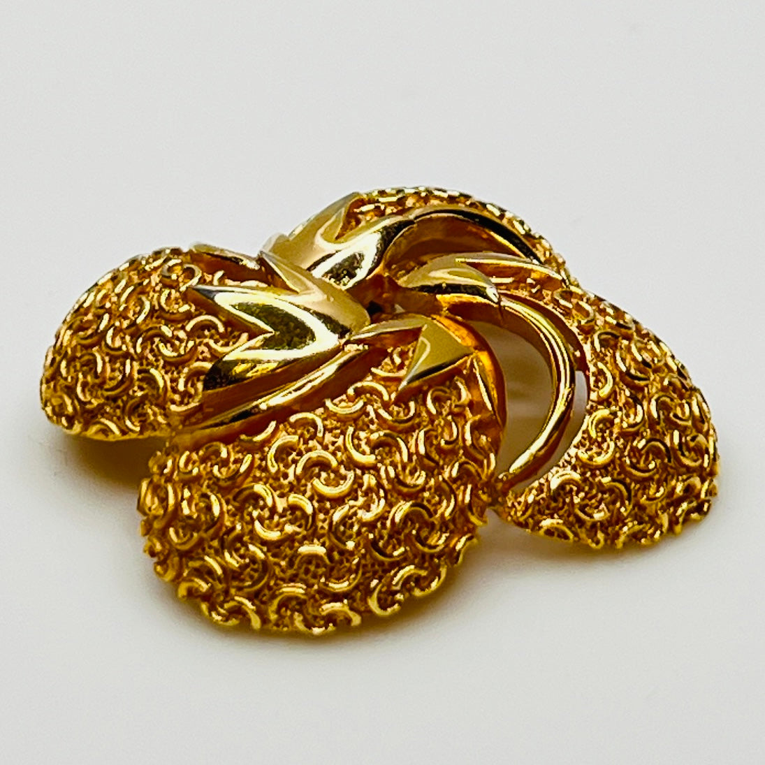 Side angle showing dimensional texture and sculpted swirl detailing