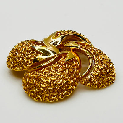 Side angle showing dimensional texture and sculpted swirl detailing