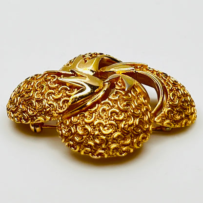 Side angle showing dimensional texture and sculpted swirl detailing