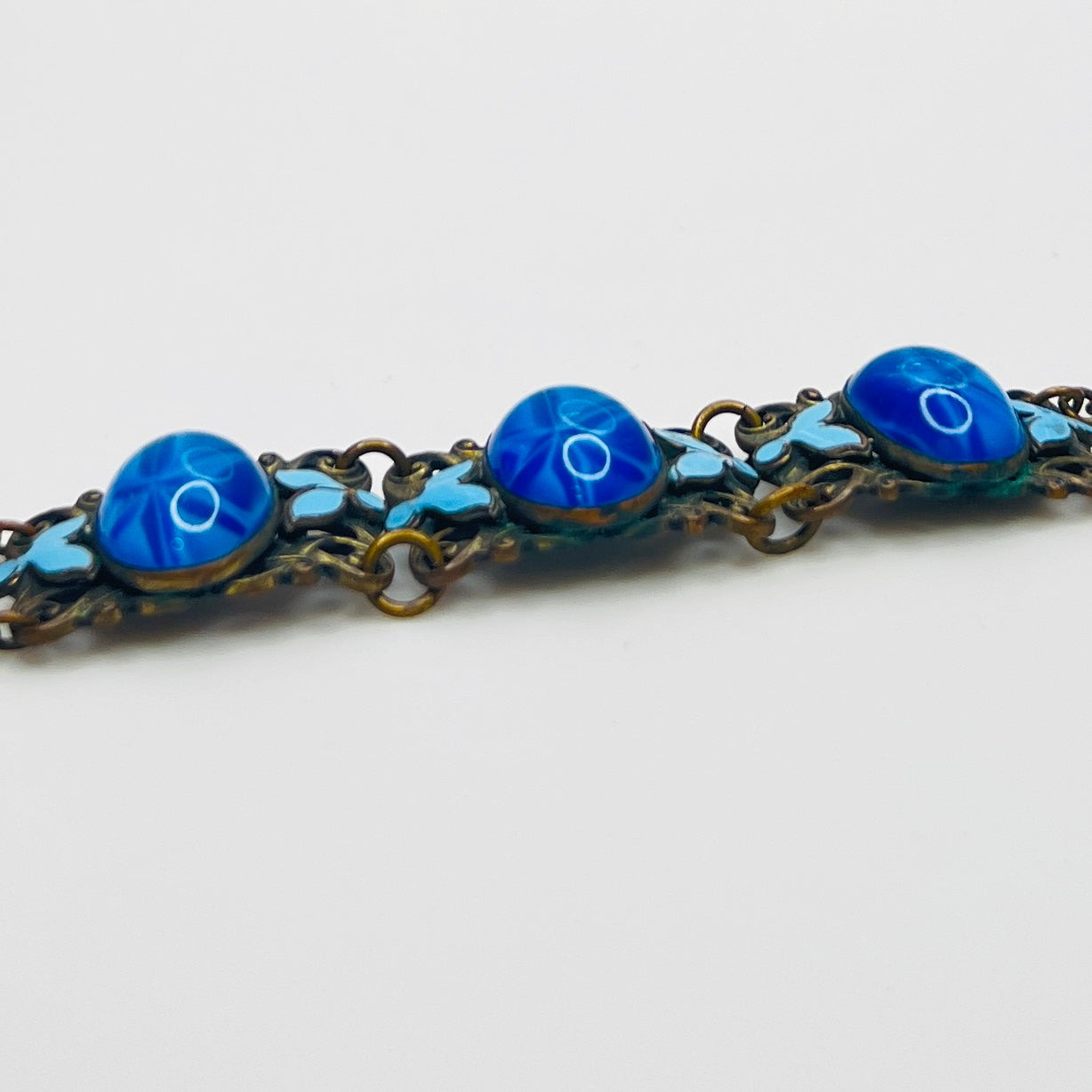 Vintage Czech starburst glass panel bracelet with enamel detail