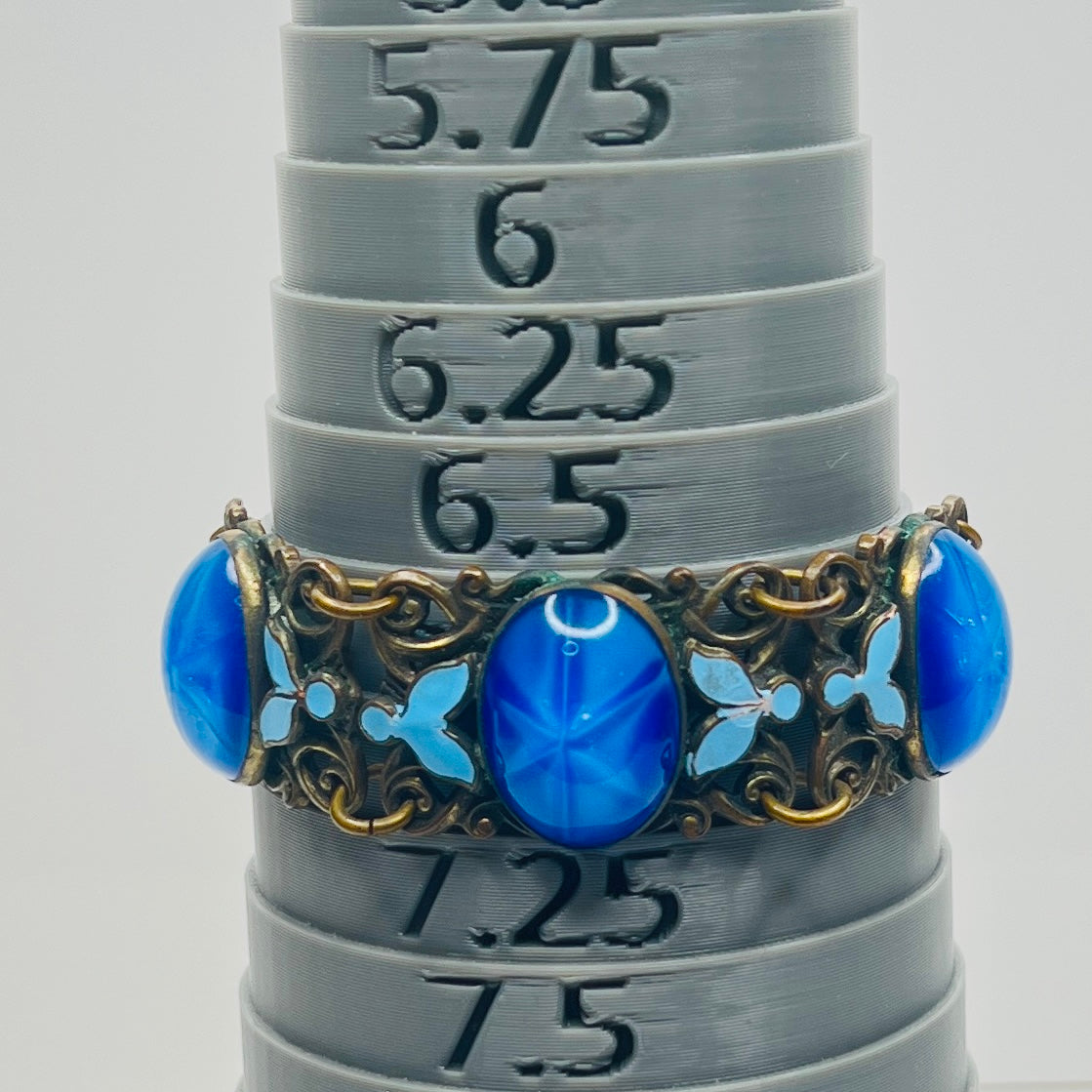 Vintage Czech starburst glass panel bracelet with enamel detail