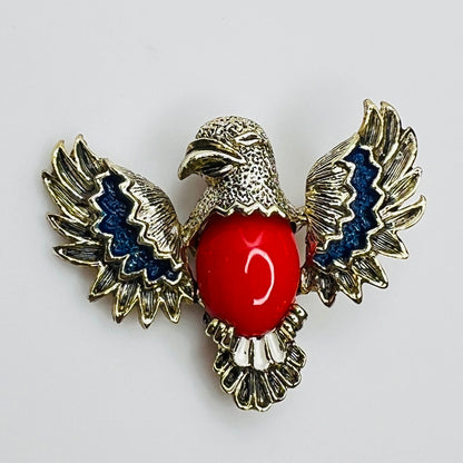 1960s Gerry’s gold tone eagle brooch with red lucite center