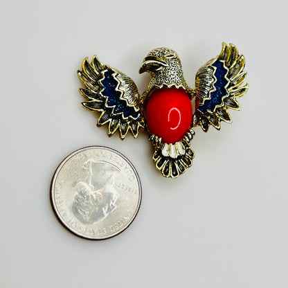 1960s Gerry’s gold tone eagle brooch with red lucite center