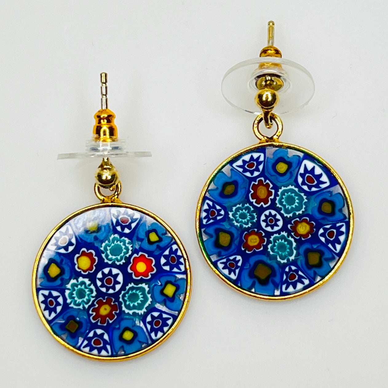 Close-up of colorful millefiori floral mosaic glass earrings