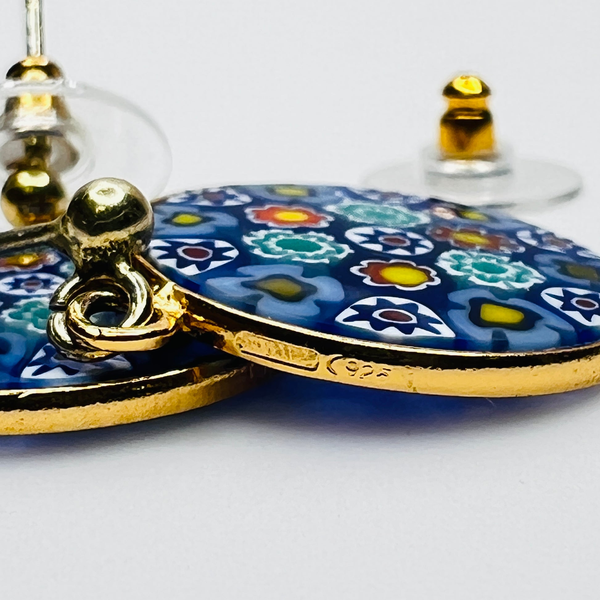 Side view of millefiori glass earrings showing gold plated frame