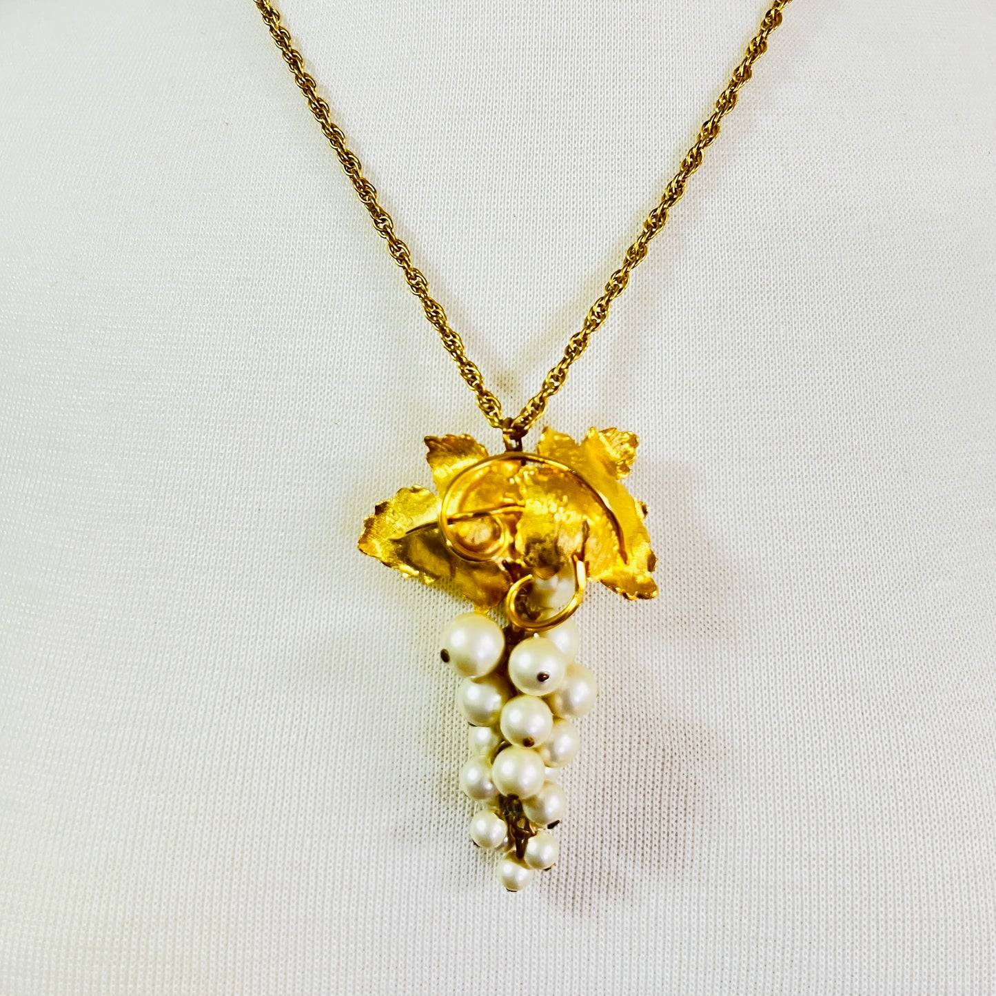 Close-up of 1950s faux pearl grape cluster convertible pendant