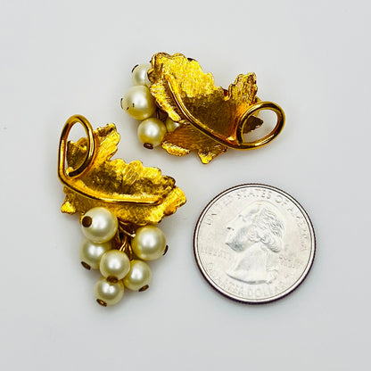 Close-up of 1950s faux pearl grape cluster clip-on earrings 