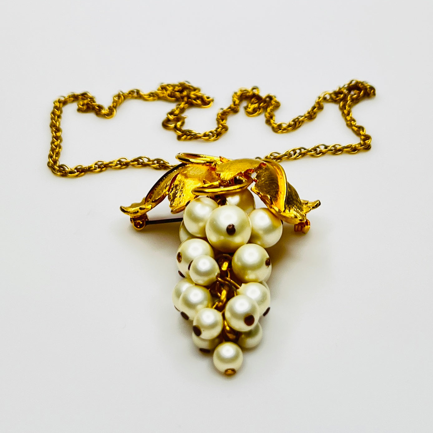 Close-up of 1950s faux pearl grape cluster convertible pendant