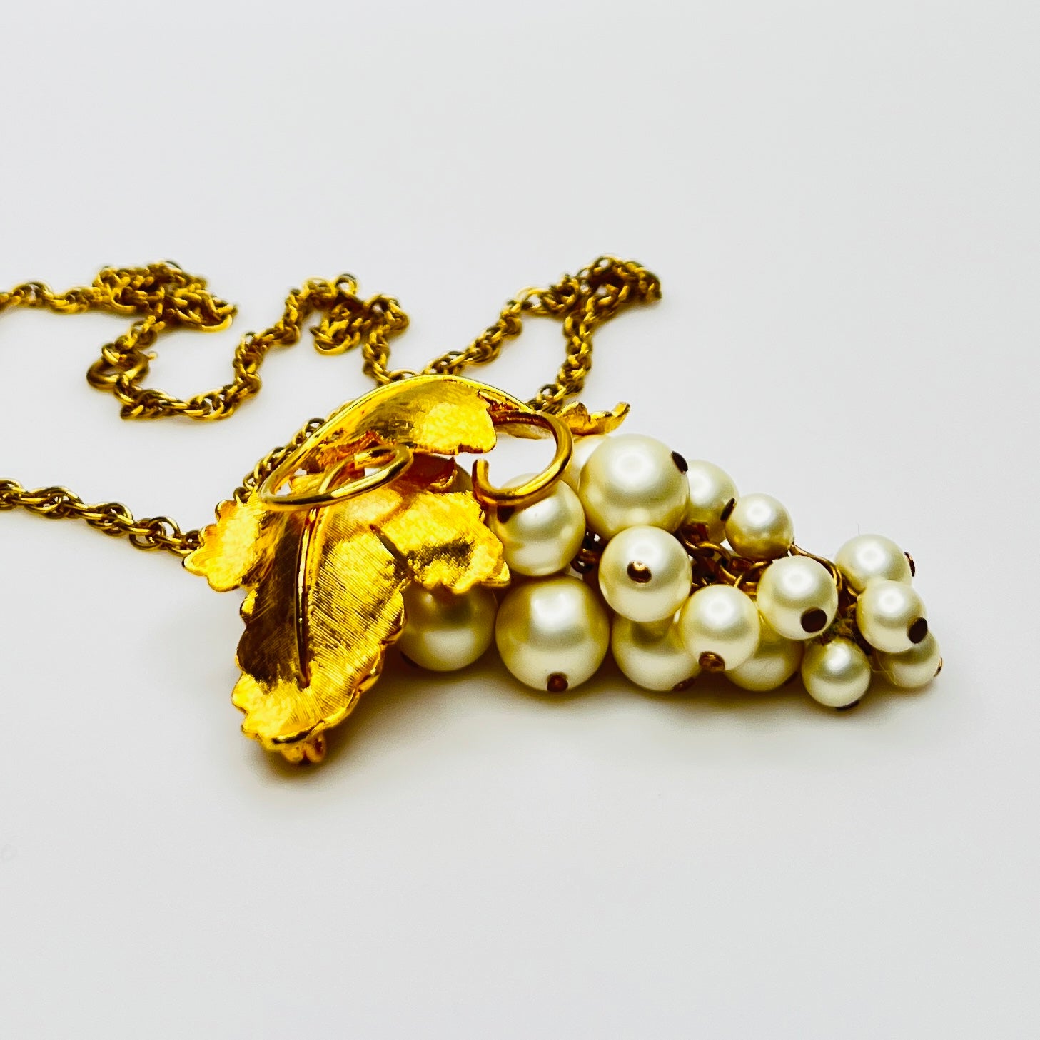 Close-up of 1950s faux pearl grape cluster convertible pendant