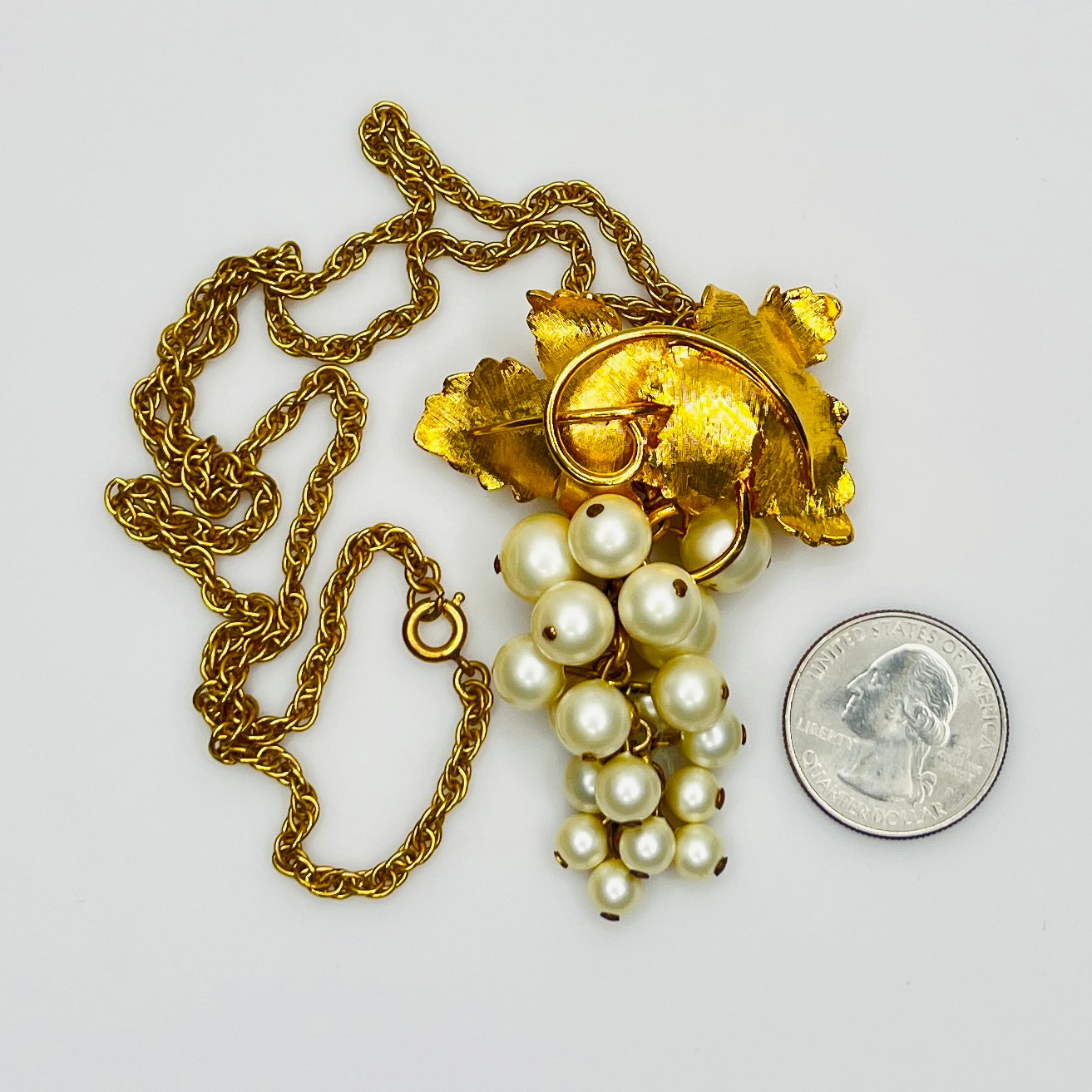 Close-up of 1950s faux pearl grape cluster convertible pendant