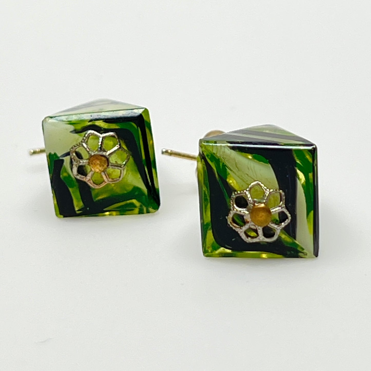 Green glass pyramid earrings with black swirl pattern, vintage 1980s pierced dangle design