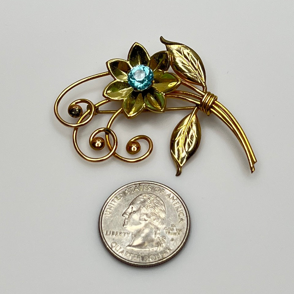 Vintage gold-filled floral brooch with blue rhinestone, signed Harry Iskin