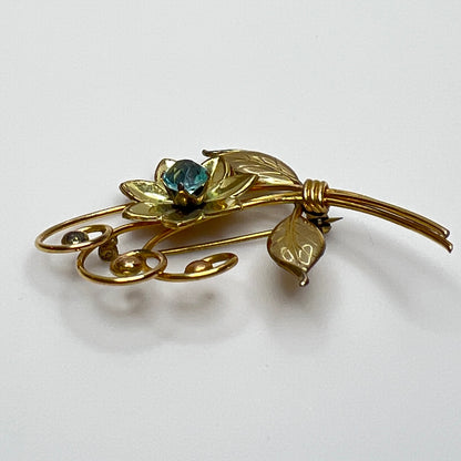 Vintage gold-filled floral brooch with blue rhinestone, signed Harry Iskin