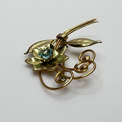 Vintage gold-filled floral brooch with blue rhinestone, signed Harry Iskin