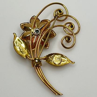 Vintage gold-filled floral brooch with blue rhinestone, signed Harry Iskin