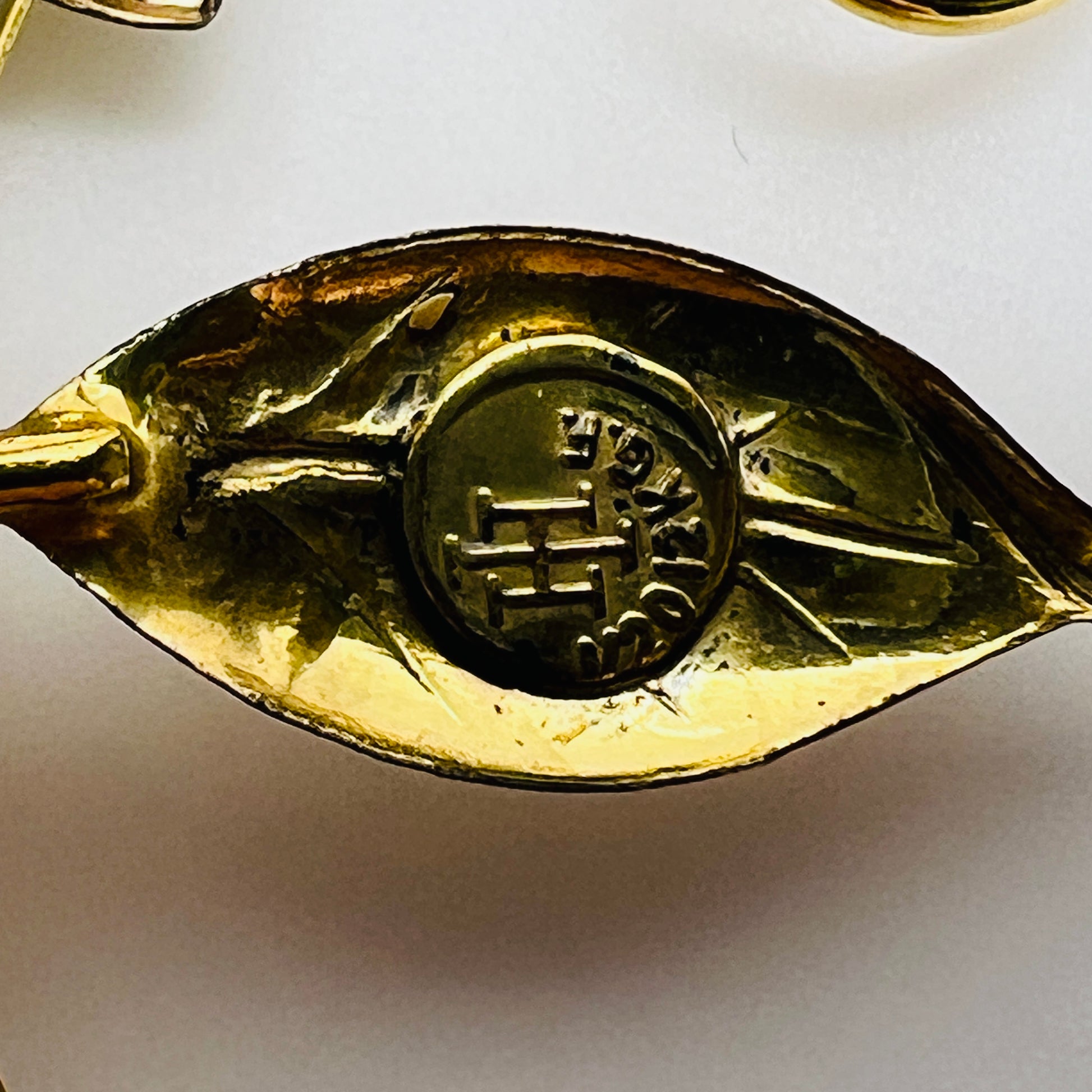 Vintage gold-filled floral brooch with blue rhinestone, signed Harry Iskin