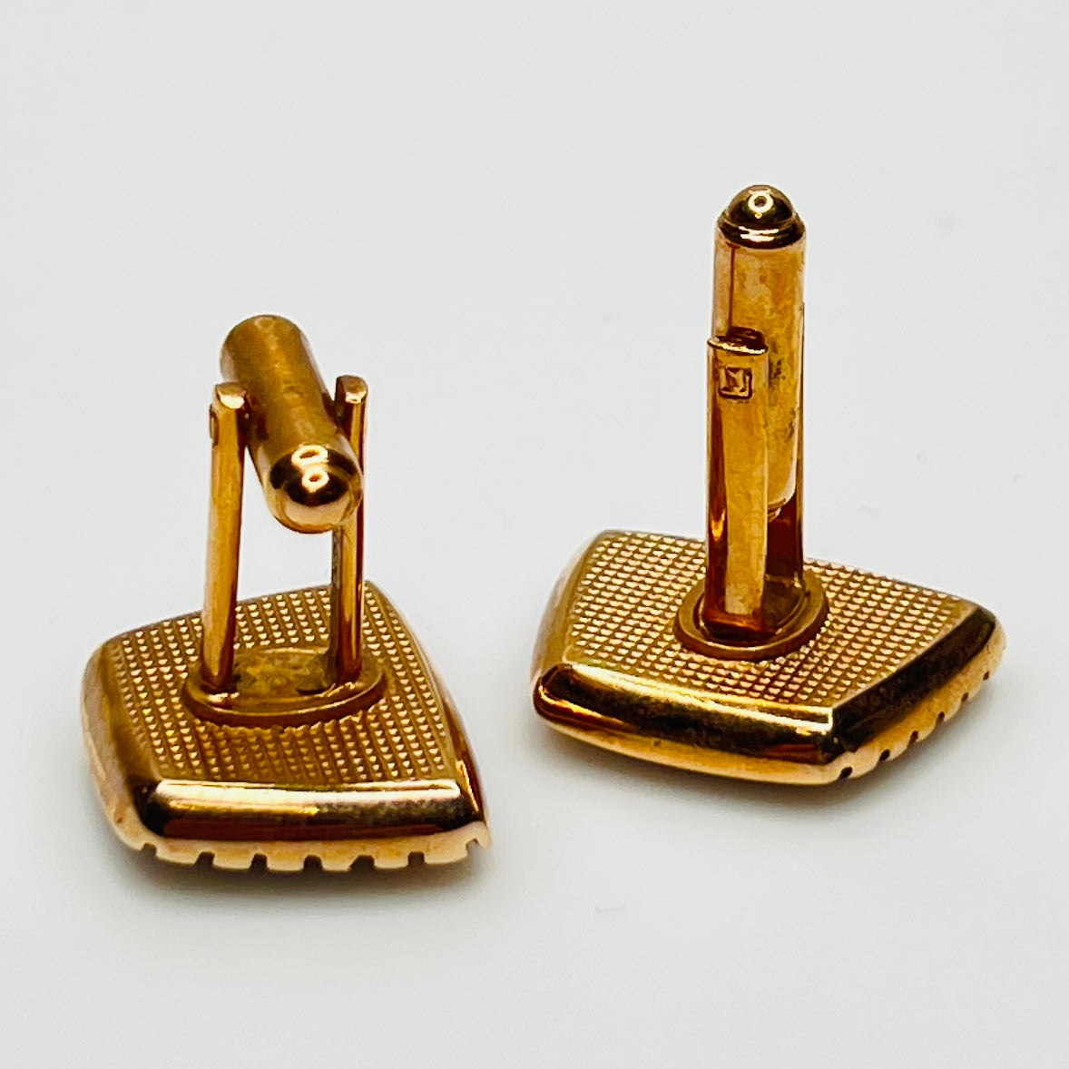 1950s Hickok cufflinks with teal glass cabochons and rose gold-tone setting