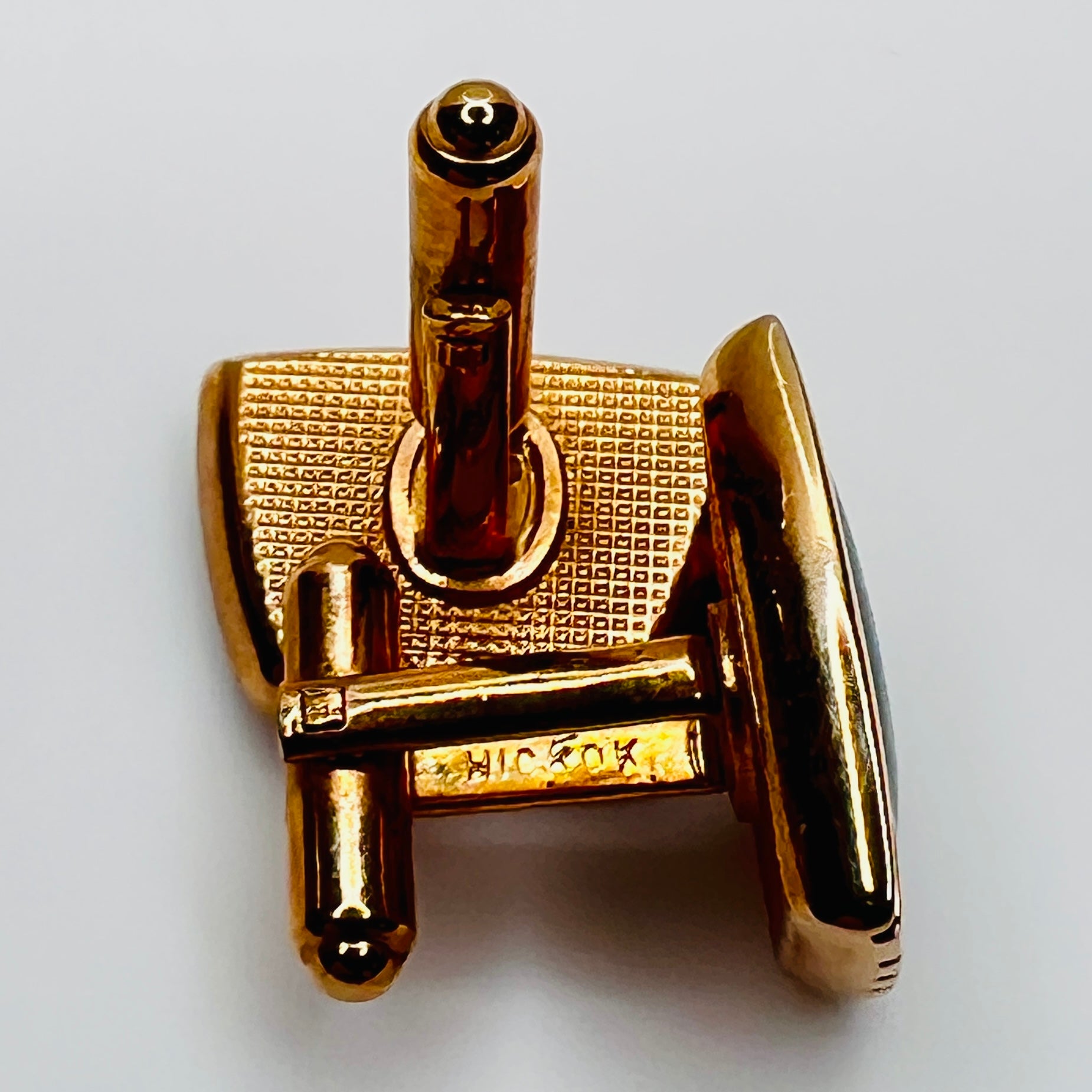 Close-up of "HICKOK" signature stamped on toggle bar