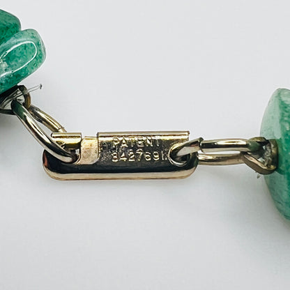 Close-up of patented gold-tone clasp stamped “3427691”