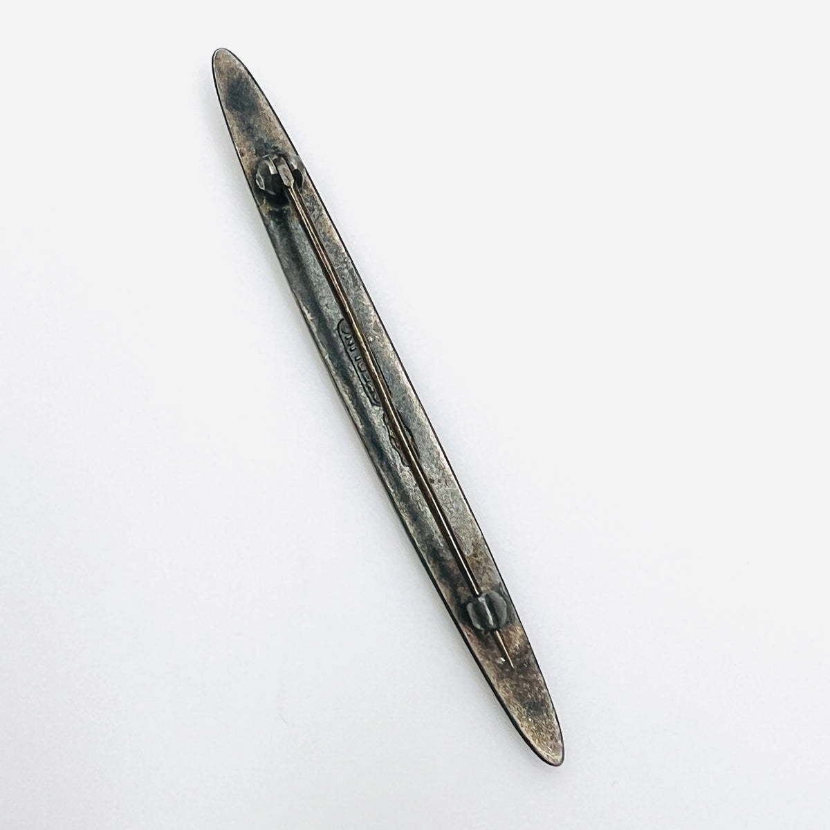 Reverse of Edwardian sterling silver enamel bar brooch with original patina