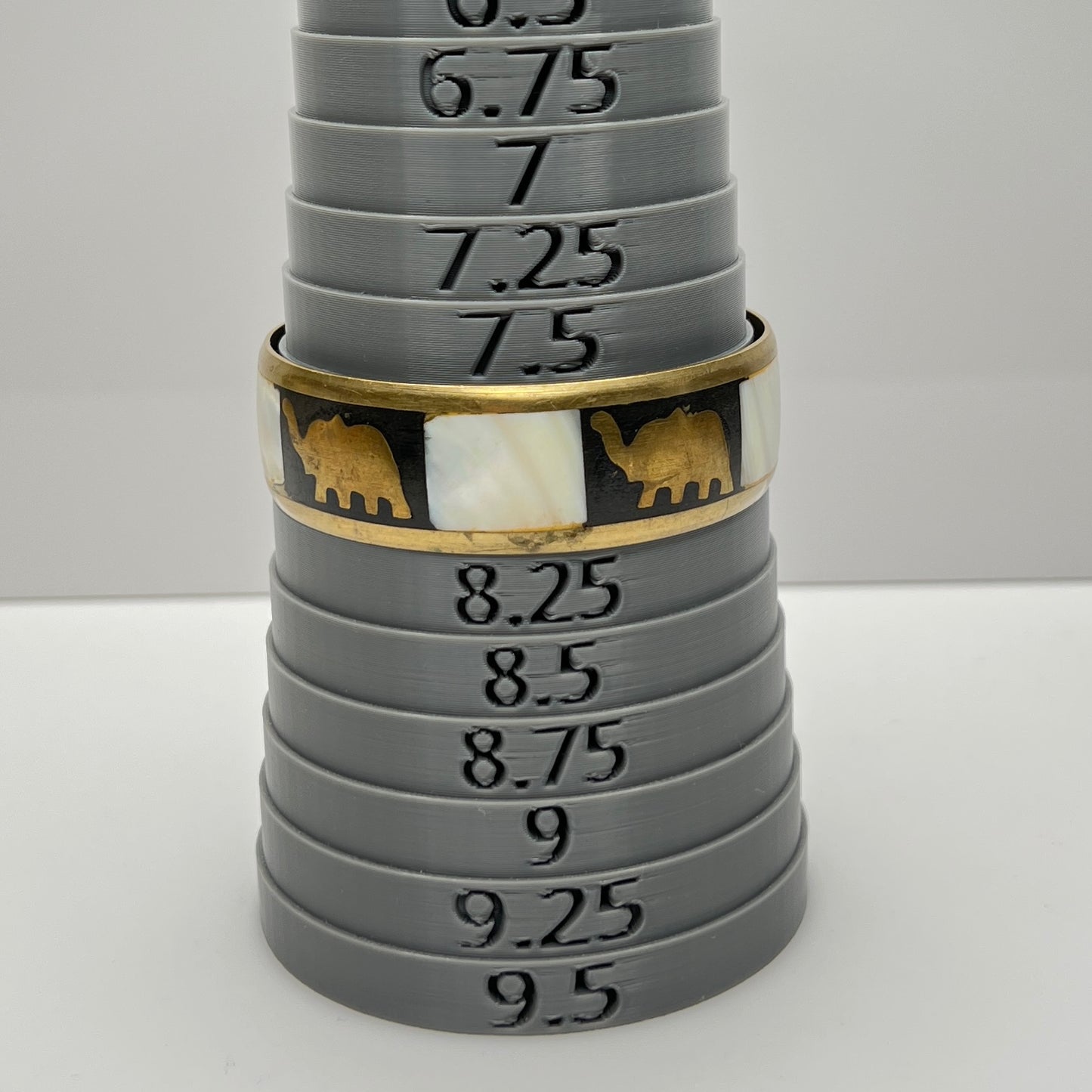 Bangle on sizing mandrel, marked at size 8