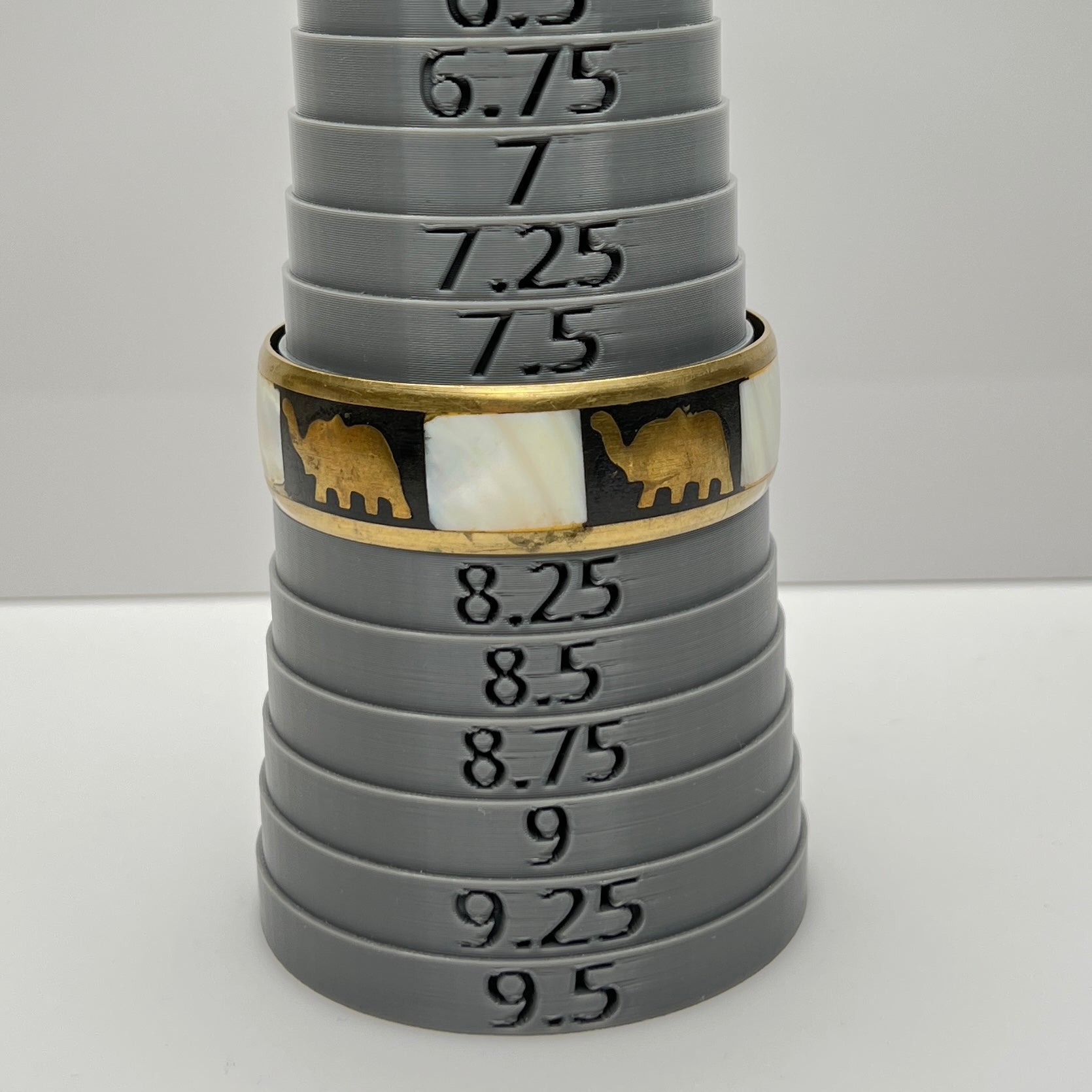 Bangle on sizing mandrel, marked at size 8