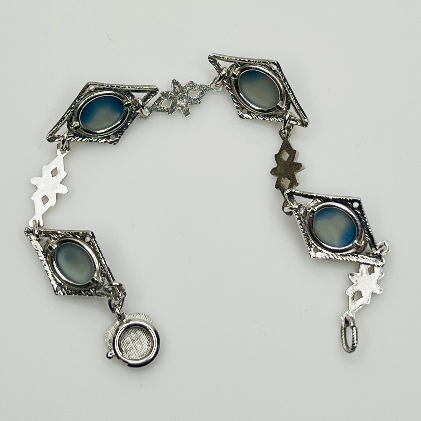 Reverse view of bracelet showing prong-set stone backs and links
