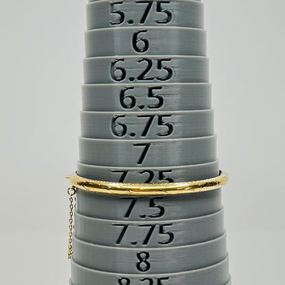 Vermeil bangle shown on bracelet mandrel at size 7.25