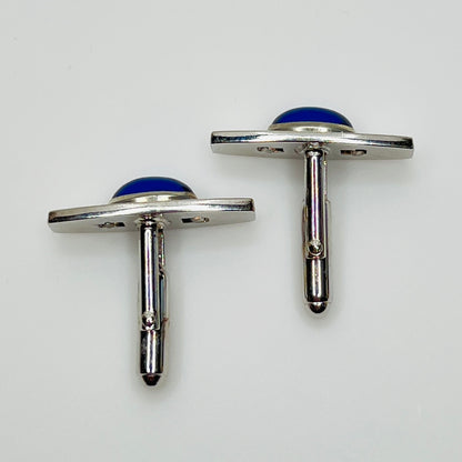 Silver-tone cufflinks with textured finish and vivid blue lucite cabochons, signed Anson