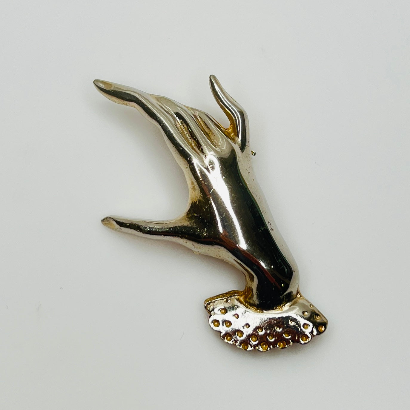 1950s silver tone sculptural hand brooch