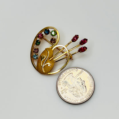 Vintage gold-tone painter’s palette brooch with multicolor rhinestones