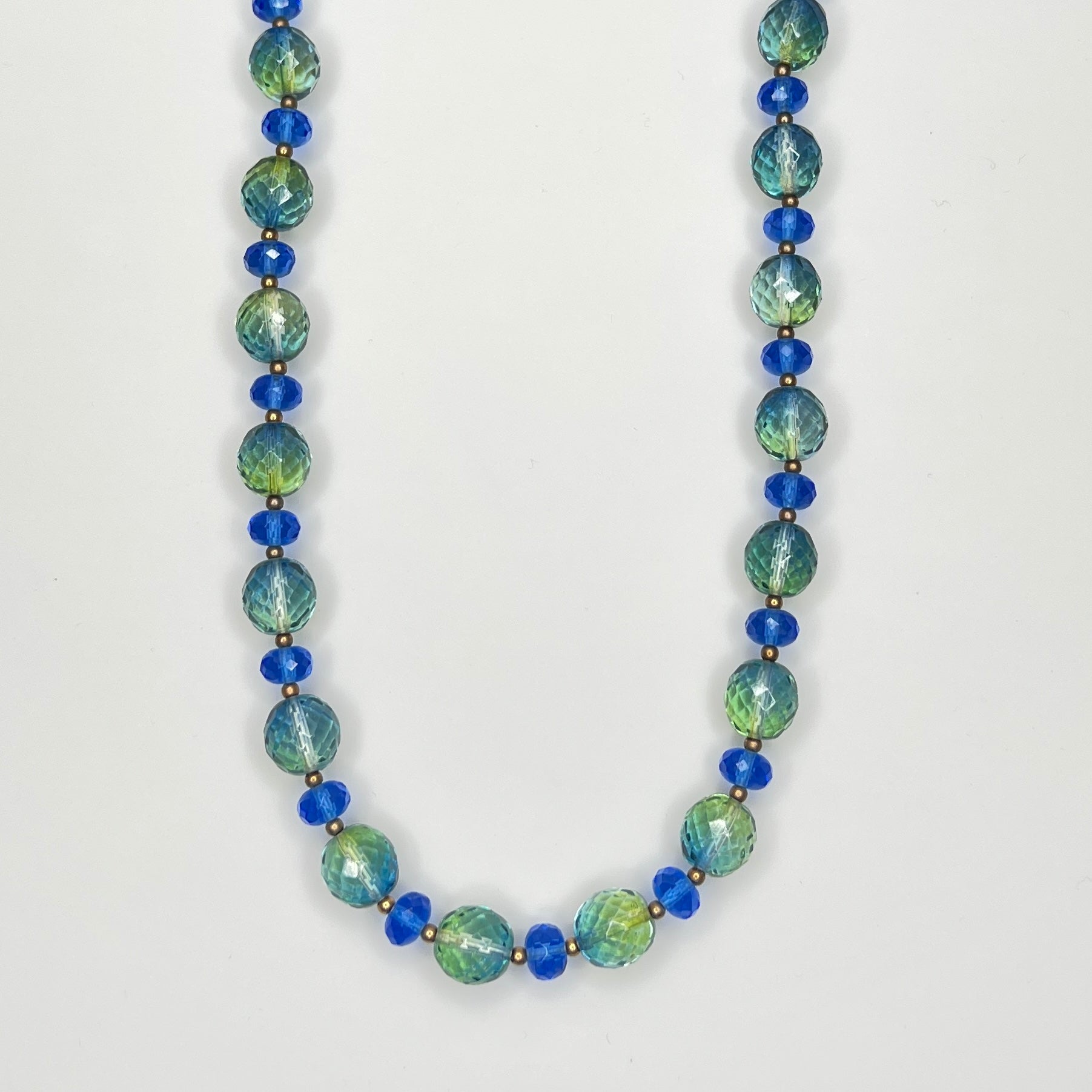 Close-up of faceted green and blue Joan Rivers crystal bead necklace