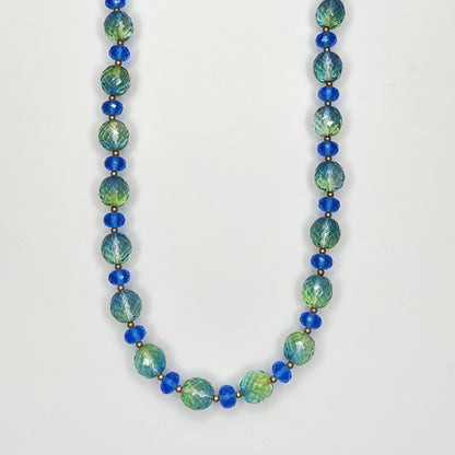 Close-up of faceted green and blue Joan Rivers crystal bead necklace
