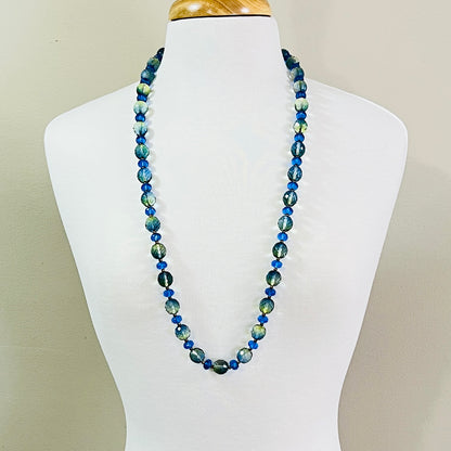 Full view of long Joan Rivers beaded necklace on display form