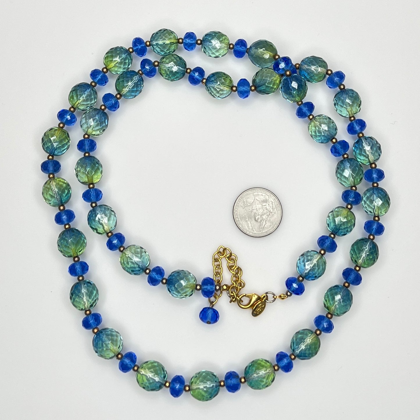 Coiled Joan Rivers necklace with gold-tone extender and clasp visible