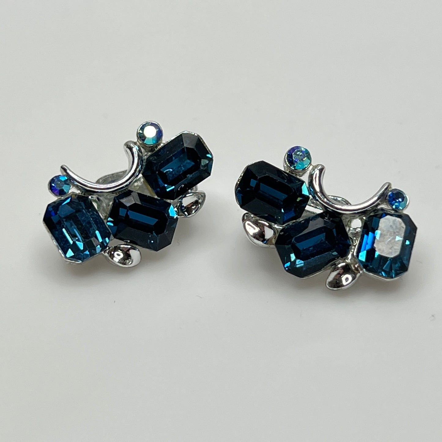 Lisner clip-on earrings with sapphire blue rhinestones and silver-tone setting