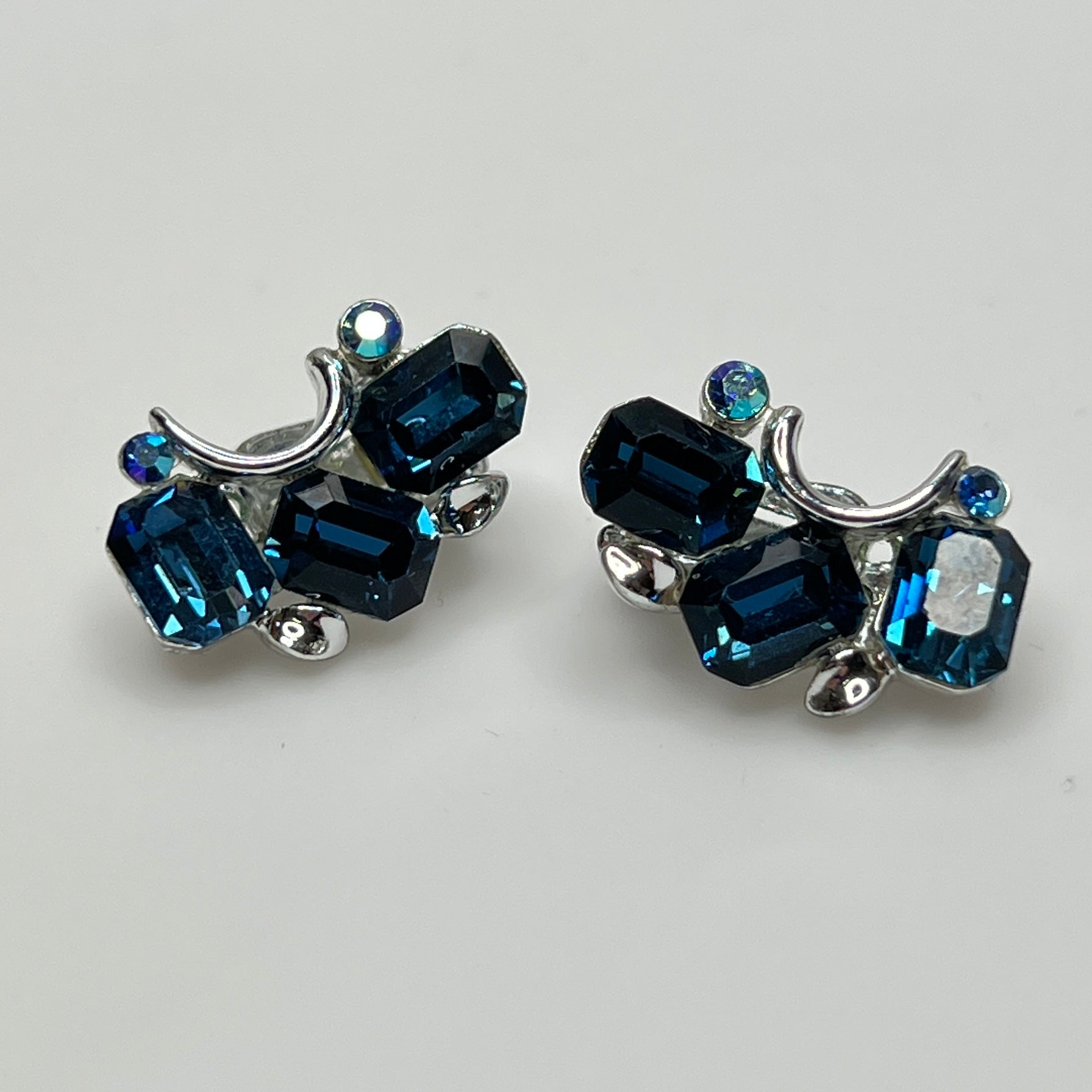 Lisner clip-on earrings with sapphire blue rhinestones and silver-tone setting